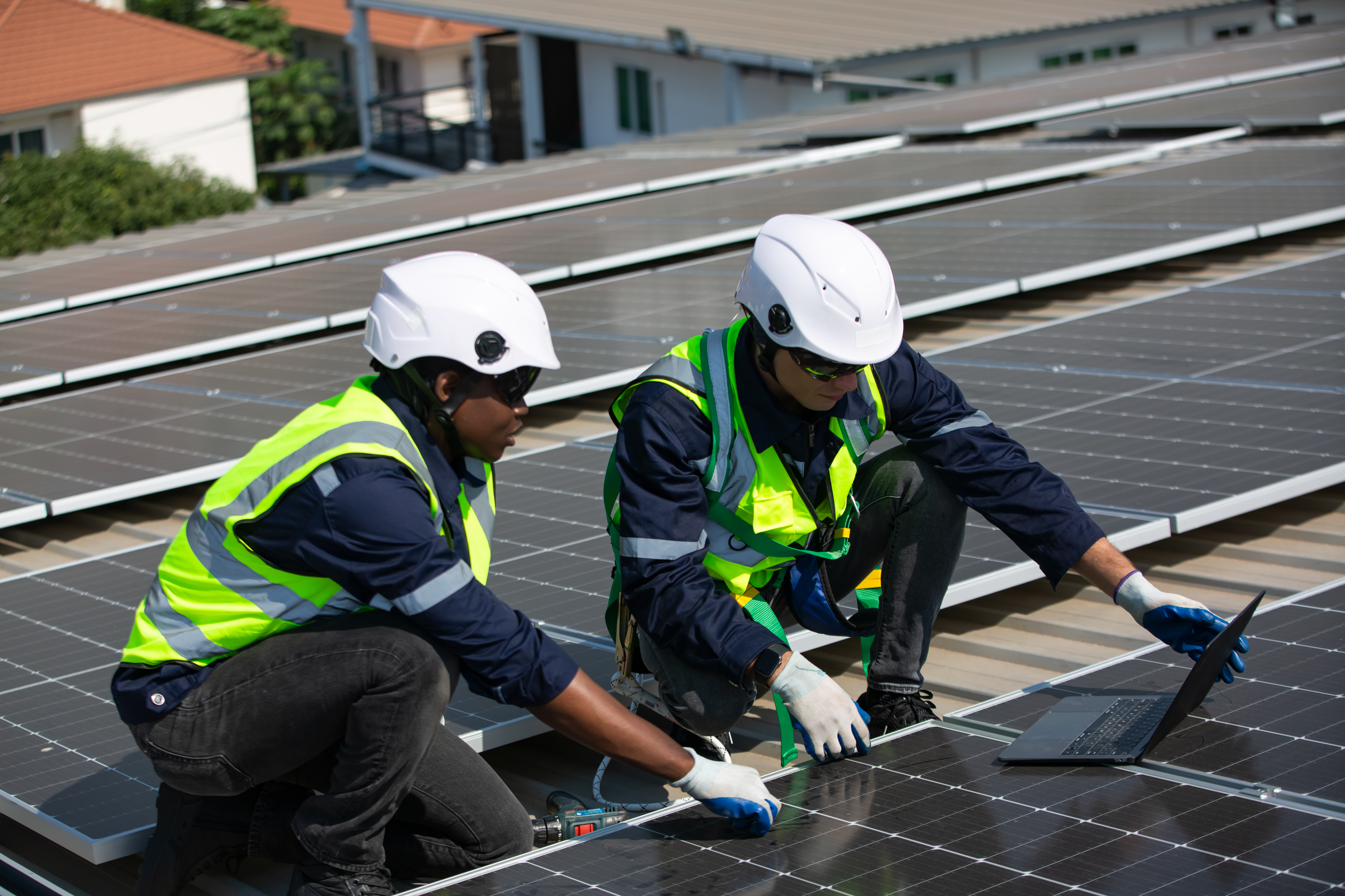 solar panel installer installing solar panels